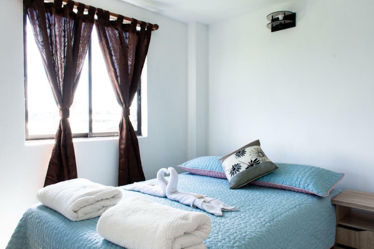 Happy Buddha Hostel & Lodge Guatape Bagian luar foto